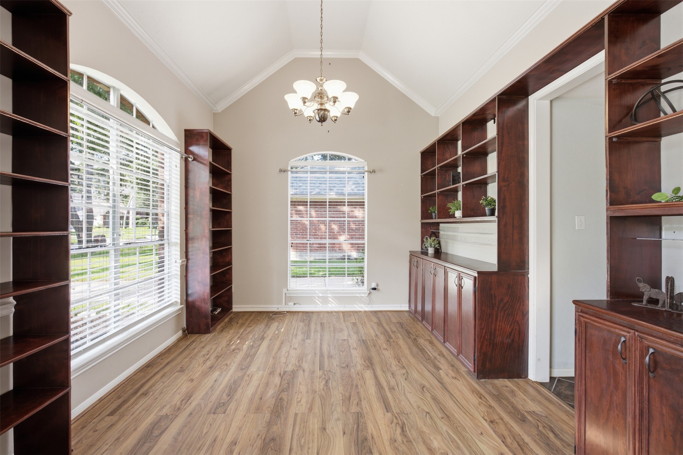 323 Magic Oaks Court Spring, TX 77388 - Photo 8 of 49 Through the front room is this thoughtfully designed den or formal dining room. Again, this room can be used for multiple functions and is not lacking in style or storage.