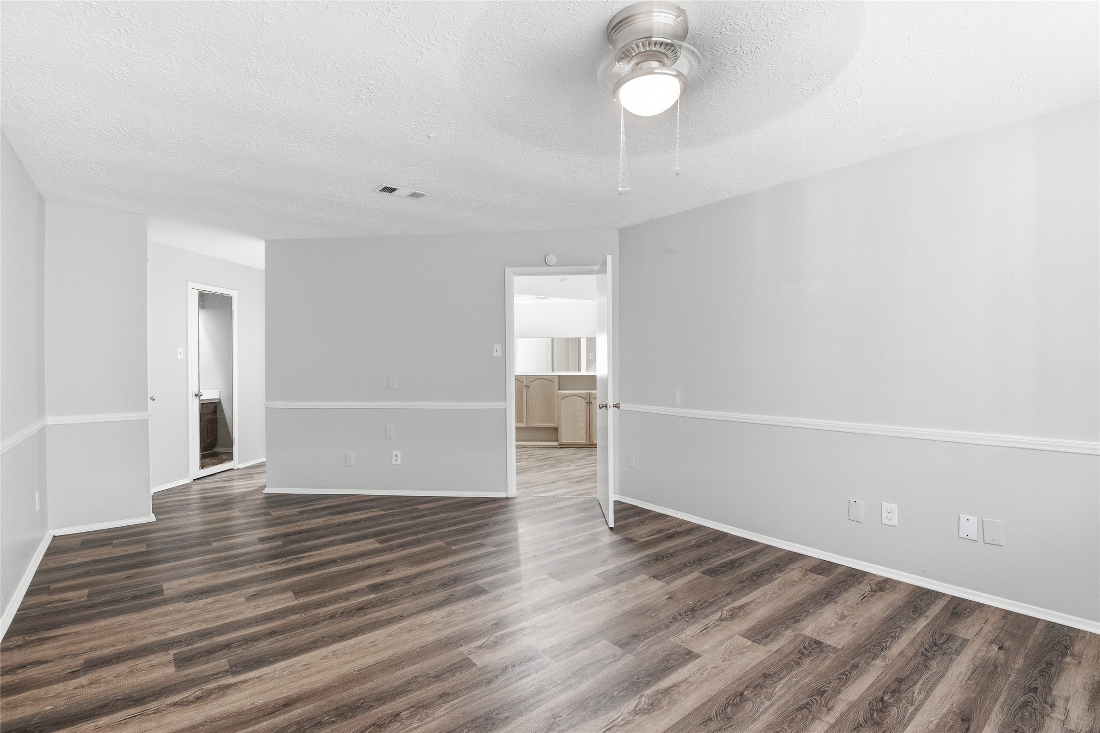 6519 Bridgegate Drive Spring, TX 77373 - Photo 12 of 23 an empty room with wooden floor and windows