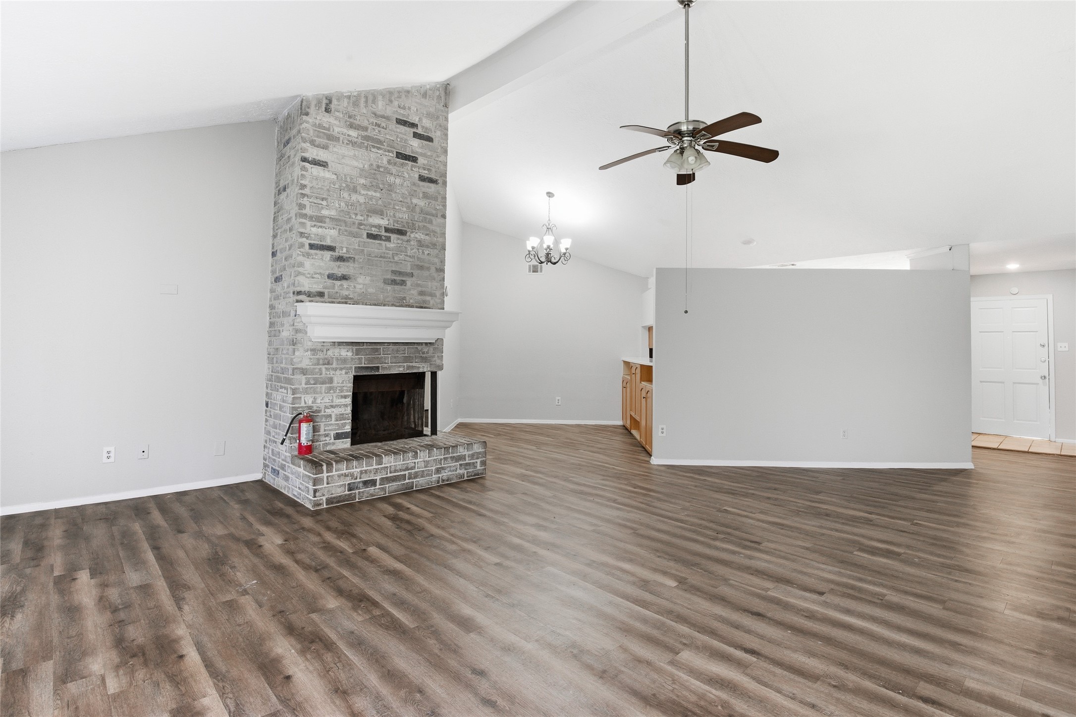 6519 Bridgegate Drive Spring, TX 77373 - Photo 4 of 23 a view of a livingroom with a fireplace and wooden floor