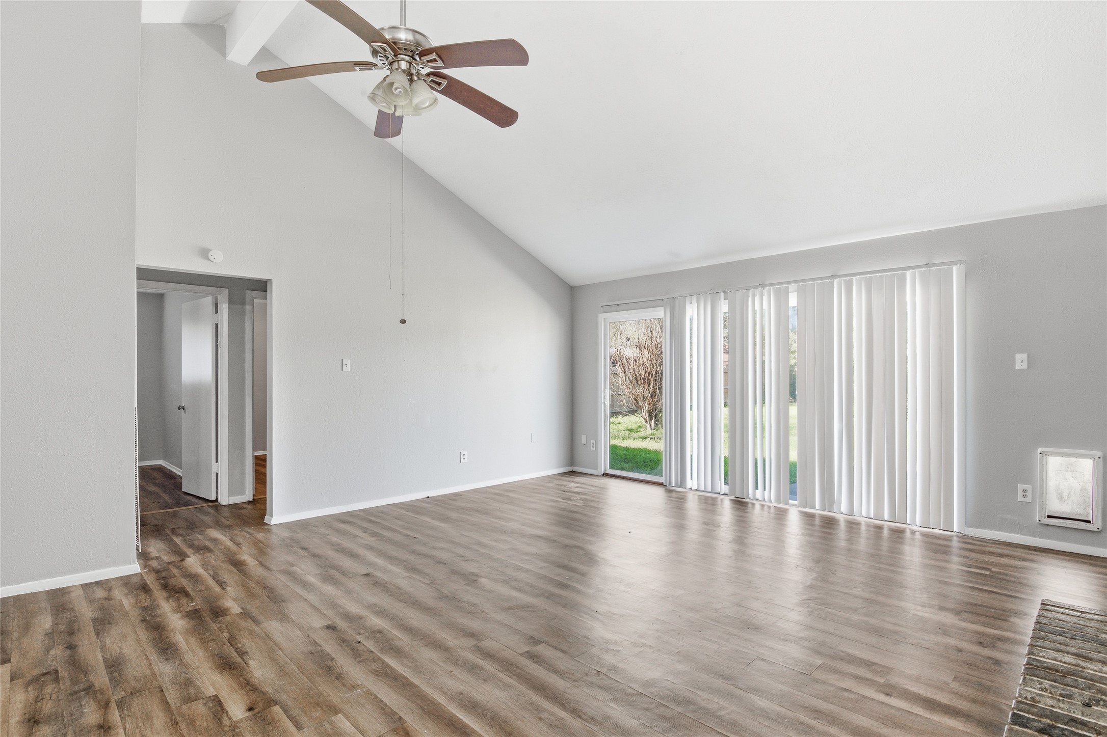 6519 Bridgegate Drive Spring, TX 77373 - Photo 6 of 23 a view of an empty room with wooden floor and a window