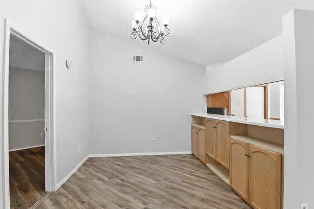 a view of a kitchen from the hallway
