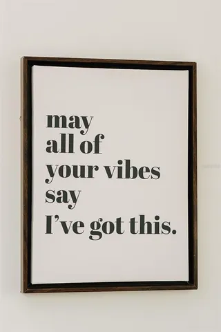 a bathroom with a sink a toilet and a window