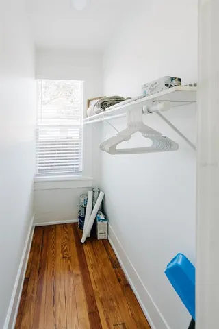 a bathroom with a sink mirror vanity and toilet