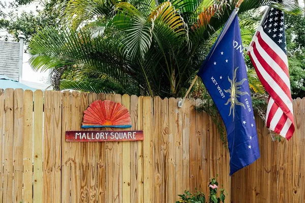 a street sign that is on a small yard