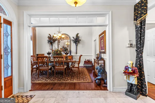 a view of a dining room with furniture window and wooden floor