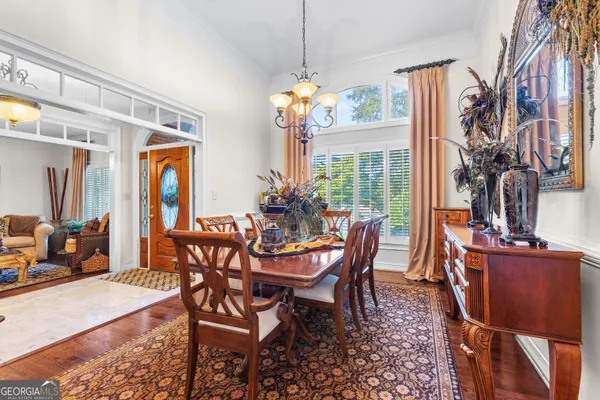 a kitchen with granite countertop white cabinets and window