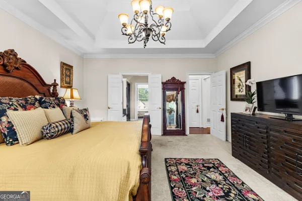 a spacious bathroom with a granite countertop sink a mirror and a shower