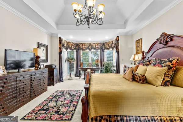 a view of a livingroom with furniture and a chandelier