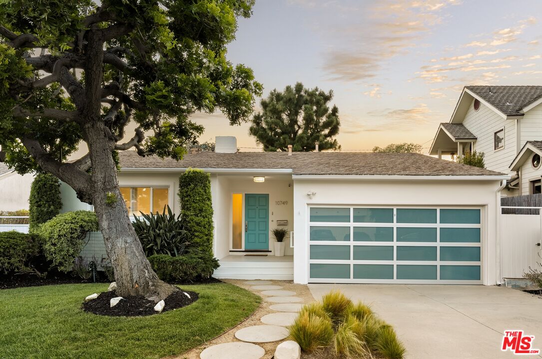 10749 Molony Road Culver City, CA 90230 - Photo 1 of 19 a front view of a house with a garden and plants