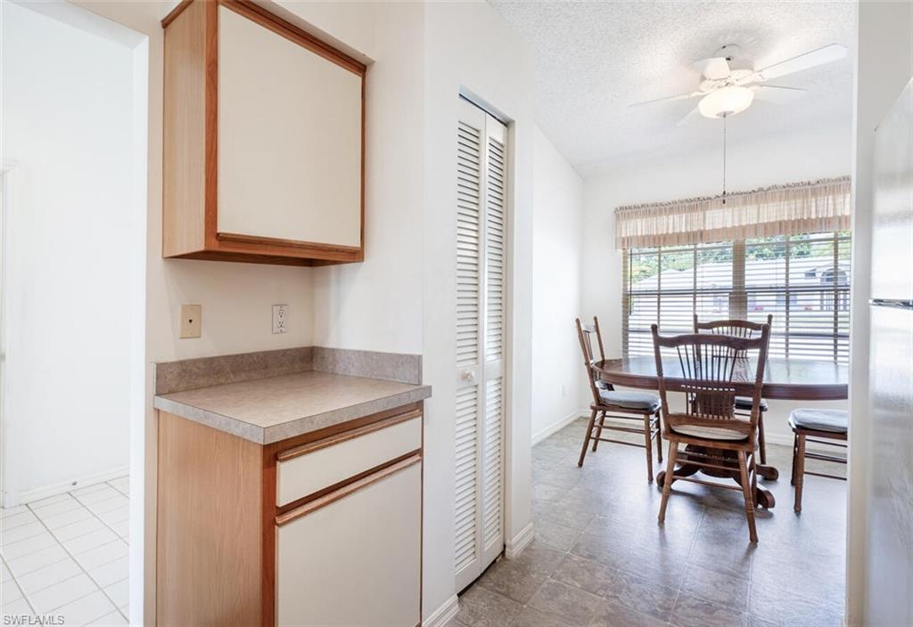 814 Charlemagne Boulevard Naples, FL 34112 - Photo 11 of 33 a kitchen with a table and chairs