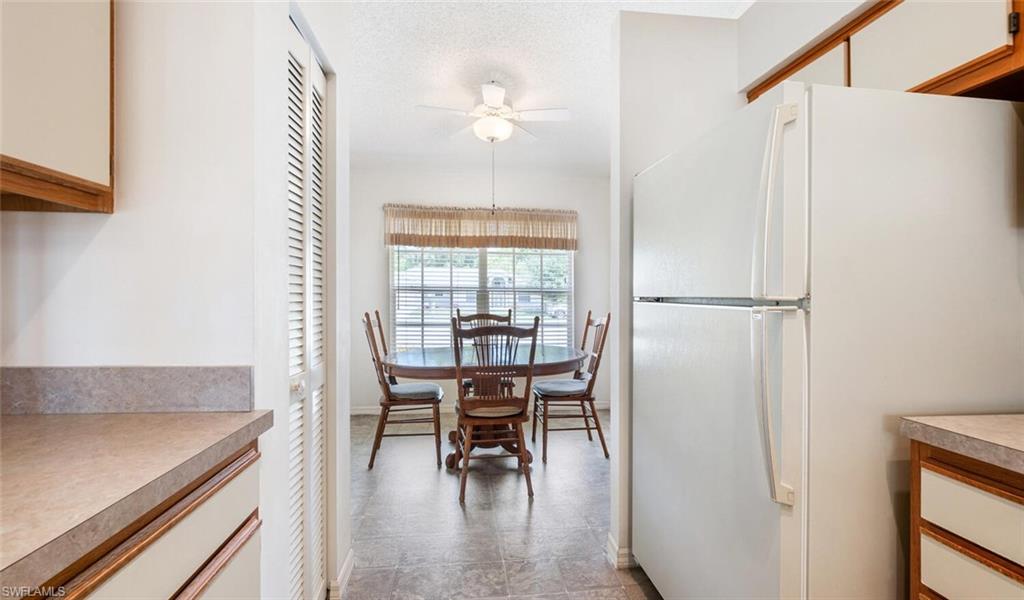 814 Charlemagne Boulevard Naples, FL 34112 - Photo 12 of 33 a view of a room with furniture and wooden floor