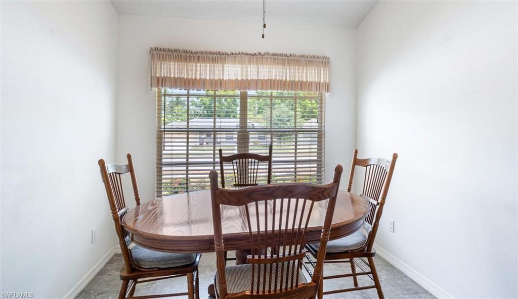 814 Charlemagne Boulevard Naples, FL 34112 - Photo 13 of 33 a view of a dining room with furniture window and outside view