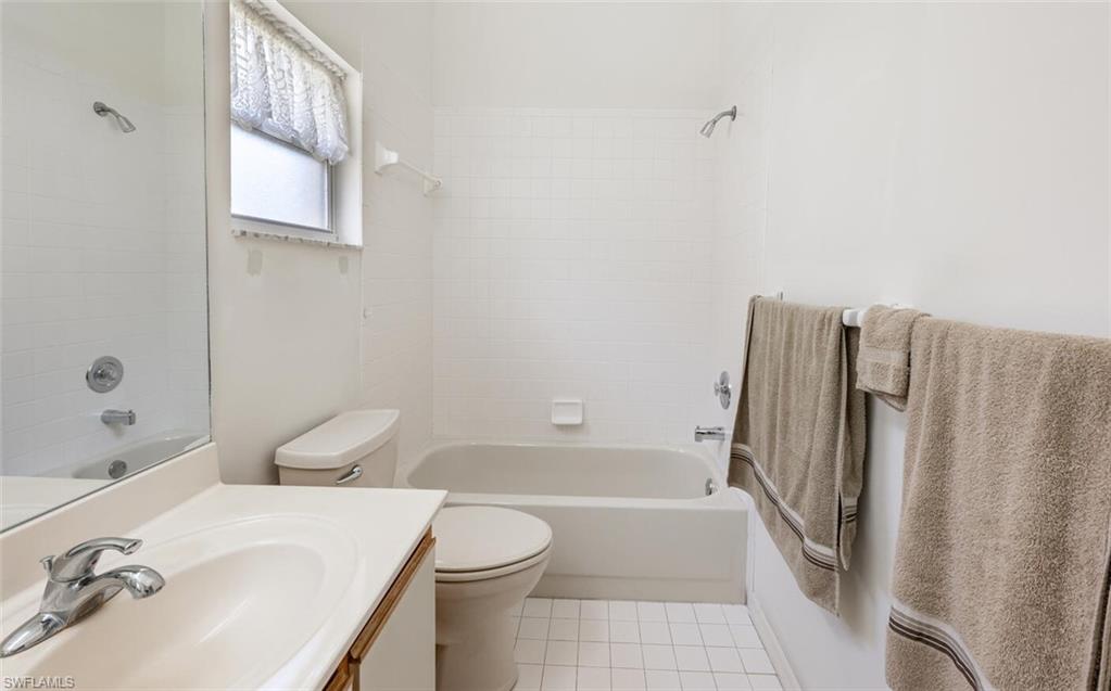 814 Charlemagne Boulevard Naples, FL 34112 - Photo 19 of 33 a bathroom with a sink toilet and shower