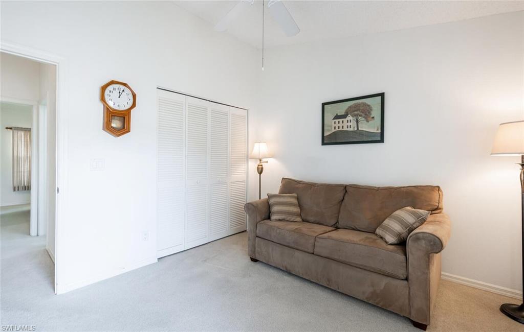 814 Charlemagne Boulevard Naples, FL 34112 - Photo 22 of 33 a living room with furniture and a window