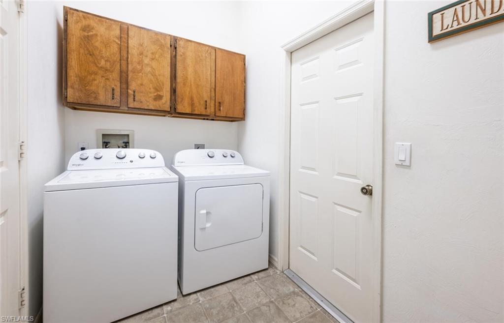 814 Charlemagne Boulevard Naples, FL 34112 - Photo 24 of 33 a utility room with dryer and washer