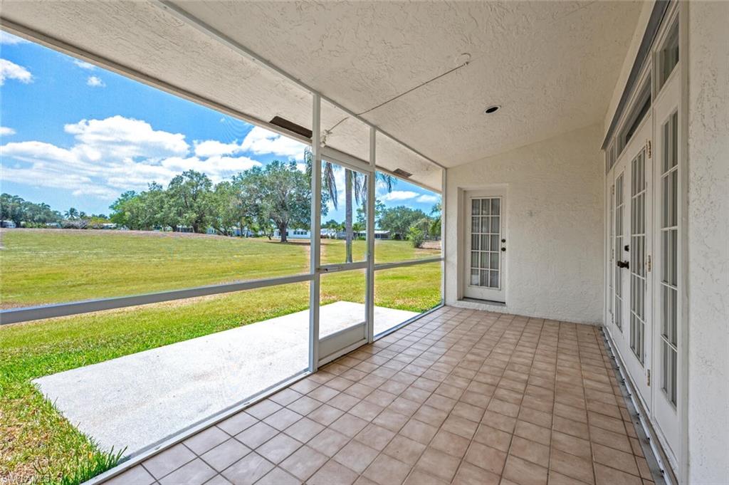 814 Charlemagne Boulevard Naples, FL 34112 - Photo 26 of 33 a view of a garden with an outdoor seating