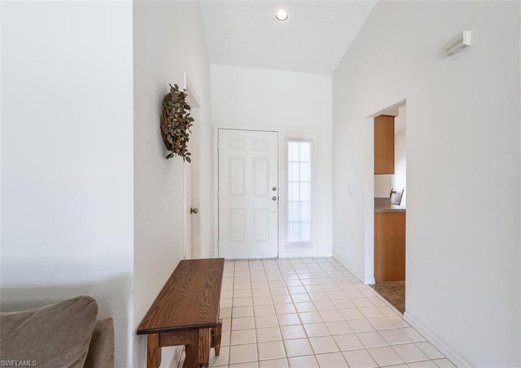 814 Charlemagne Boulevard Naples, FL 34112 - Photo 3 of 33 a view of room with window and hardwood