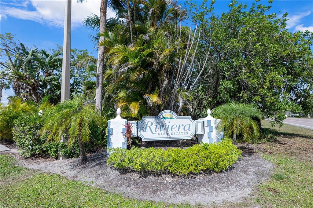 814 Charlemagne Boulevard Naples, FL 34112 - Photo 33 of 33 a sign on the side of the road