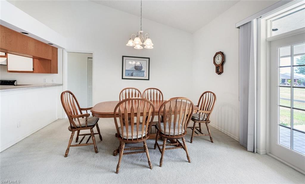 814 Charlemagne Boulevard Naples, FL 34112 - Photo 7 of 33 a view of a dining room with furniture window and outside view