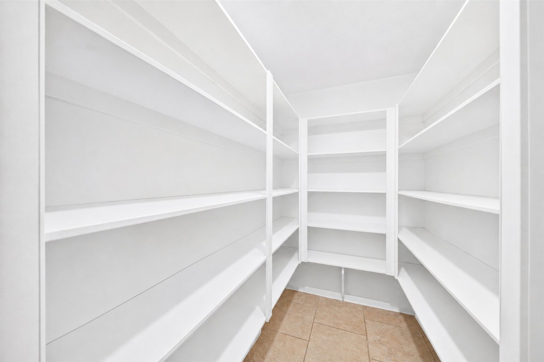 6507 Spring Leaf Drive Spring, TX 77379 - Photo 12 of 50 A huge walk-in pantry with built-in shelving means you'll never run out of space for snacks or kitchen gadgets!