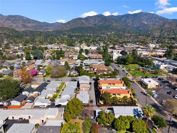 an aerial view of residential houses and street