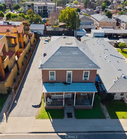 an aerial view of a house with swimming pool patio and outdoor seating