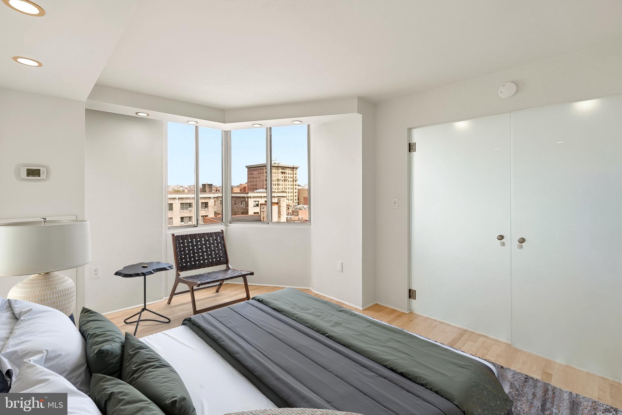 1718 P Street Northwest, Unit 902 Washington, DC 20036 - Photo 8 of 37 Modern bedroom with city views.