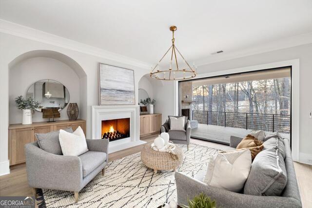 2701 Conns Creek Road, Unit 40 Ball Ground, GA 30107 - Photo 13 of 16 a living room with furniture and a fireplace
