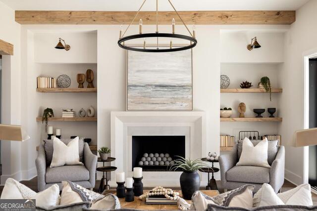 2701 Conns Creek Road, Unit 40 Ball Ground, GA 30107 - Photo 9 of 16 a living room with furniture a window and a fireplace