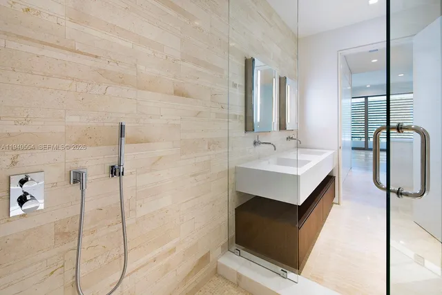 a bathroom with a sink and mirror