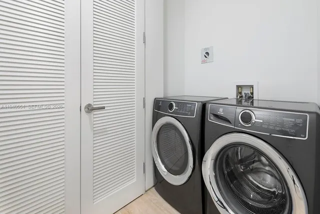 a utility room with dryer and washer