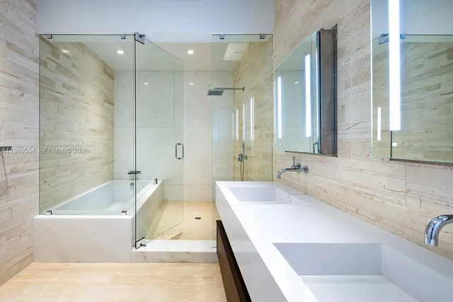 a bathroom with a bathtub and a sink