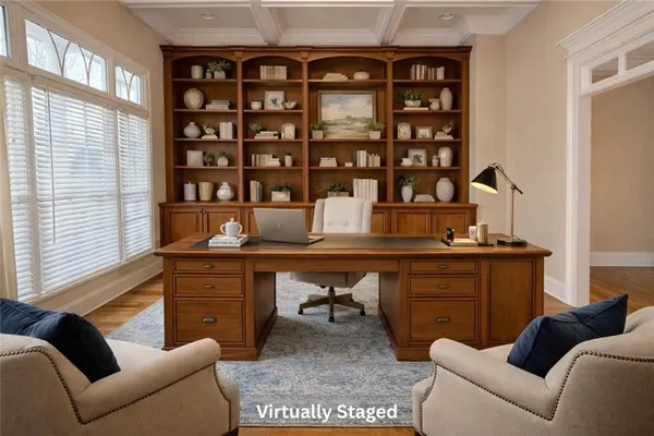 a reading room with furniture and a window