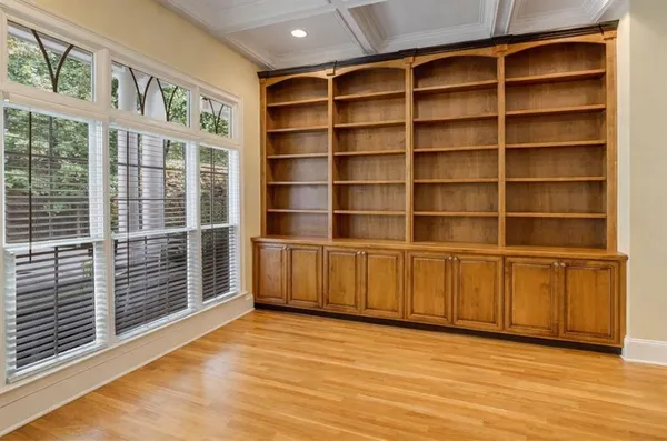 a view of a room with shelves on the wall