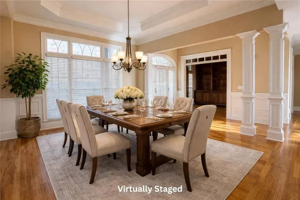 a view of a dining room with furniture window and wooden floor