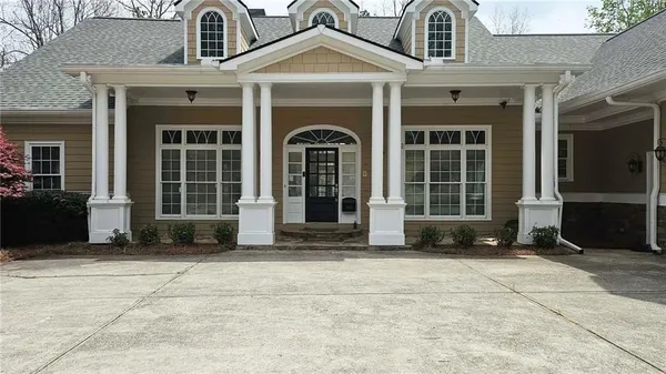 a front view of a house with a yard