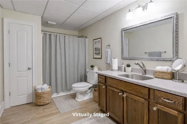 a bathroom with double sink and a toilet