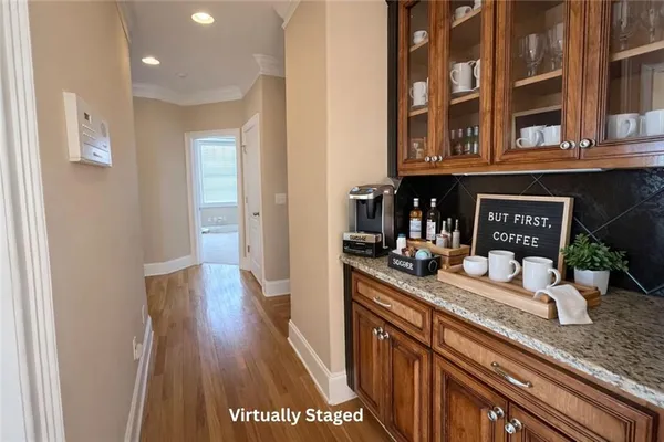 a view of a kitchen from a hallway