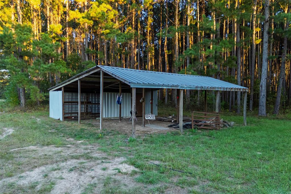0 Farm To Market Road 23 Rusk, TX 75785 - Photo 8 of 40 a front view of a house with garden