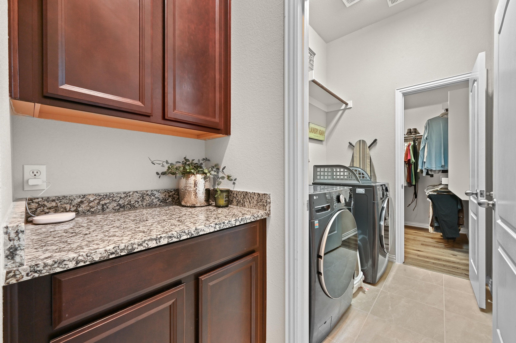 546 Hot Spring Valley Buda, TX 78610 - Photo 23 of 27 Laundry area with light tile patterned floors and separate washer and dryer