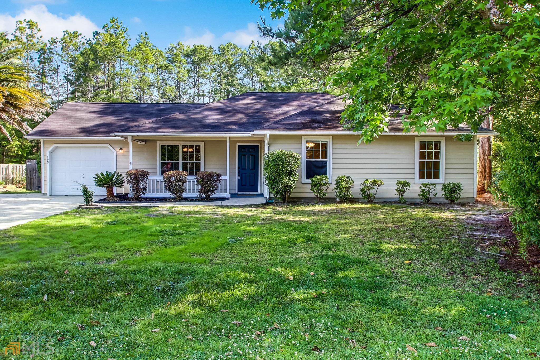 109 Woodhollow Road Kingsland, GA 31548 - Photo 1 of 1 a view of a house with a yard and potted plants