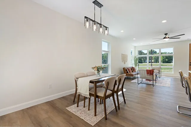 a view of a dining room with furniture window and outside view