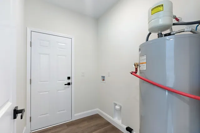 a front view of a house with a garden and yard