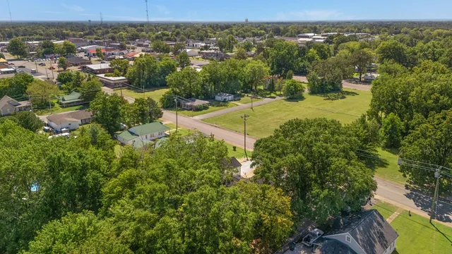 an aerial view of a house with outdoor space