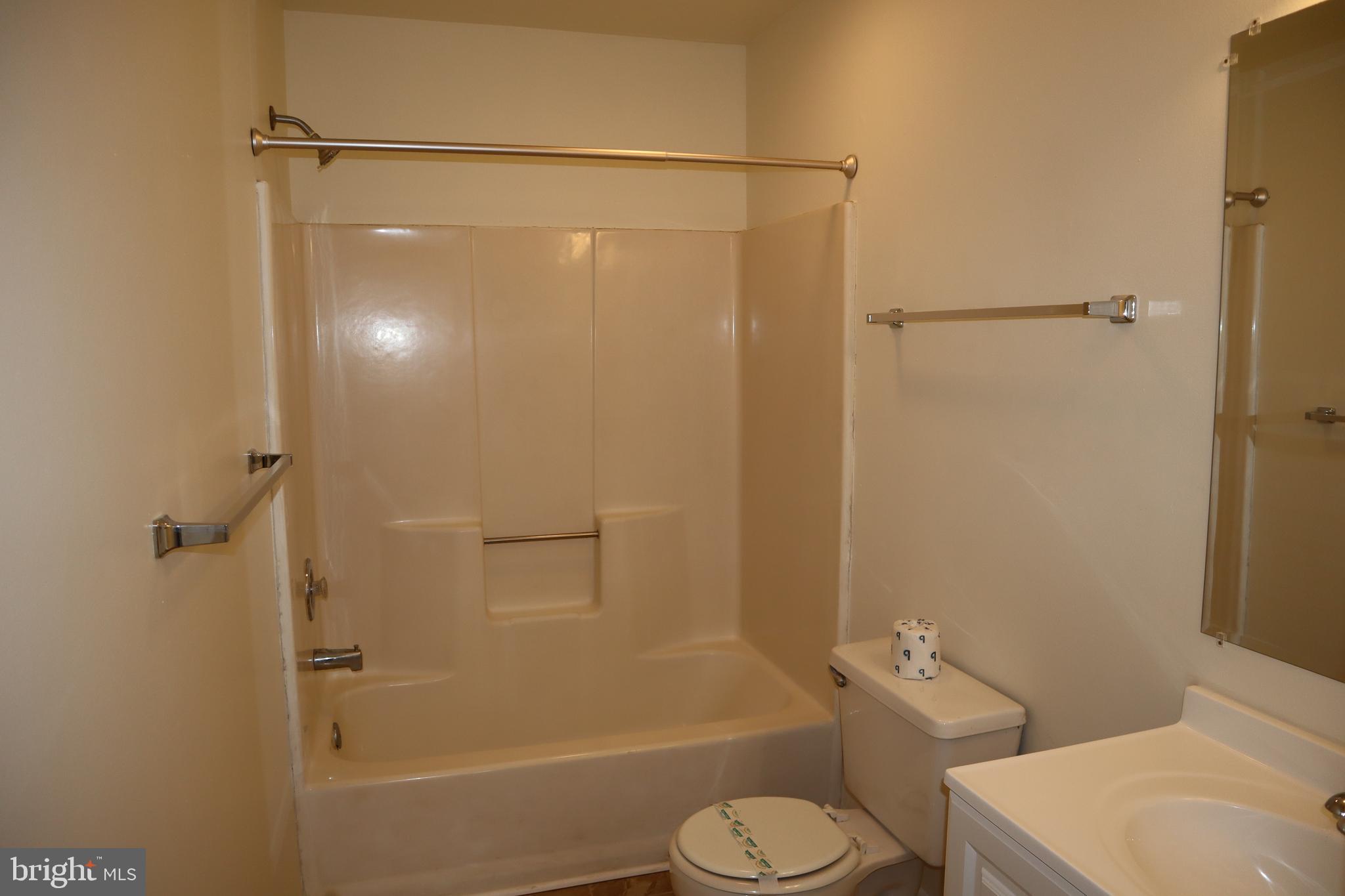 2 West Pine Street Delmar, MD 21875 - Photo 14 of 23 a bathroom with a shower a toilet and a sink