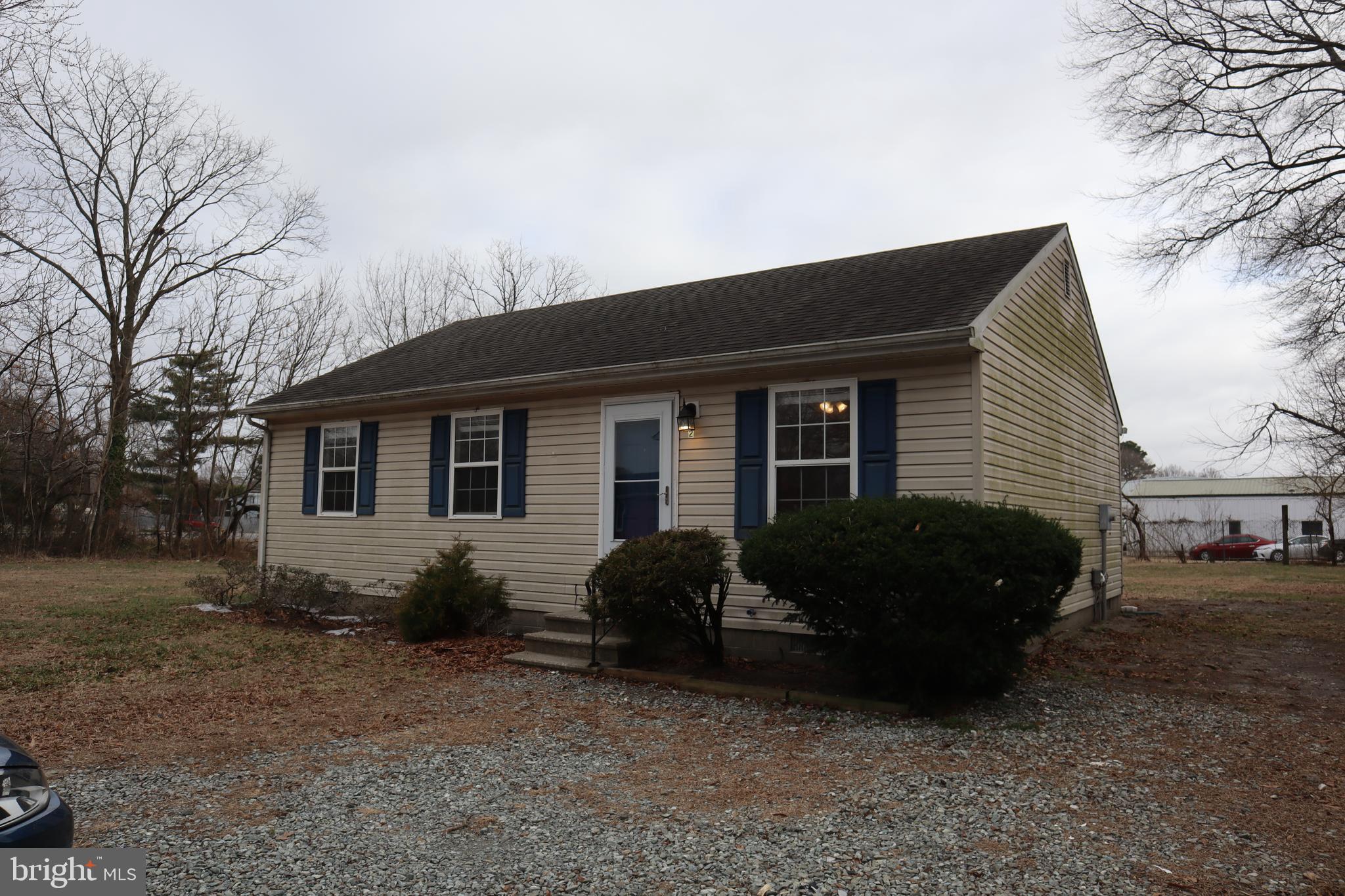 2 West Pine Street Delmar, MD 21875 - Photo 21 of 23 a house that has a lot of plants and trees in it