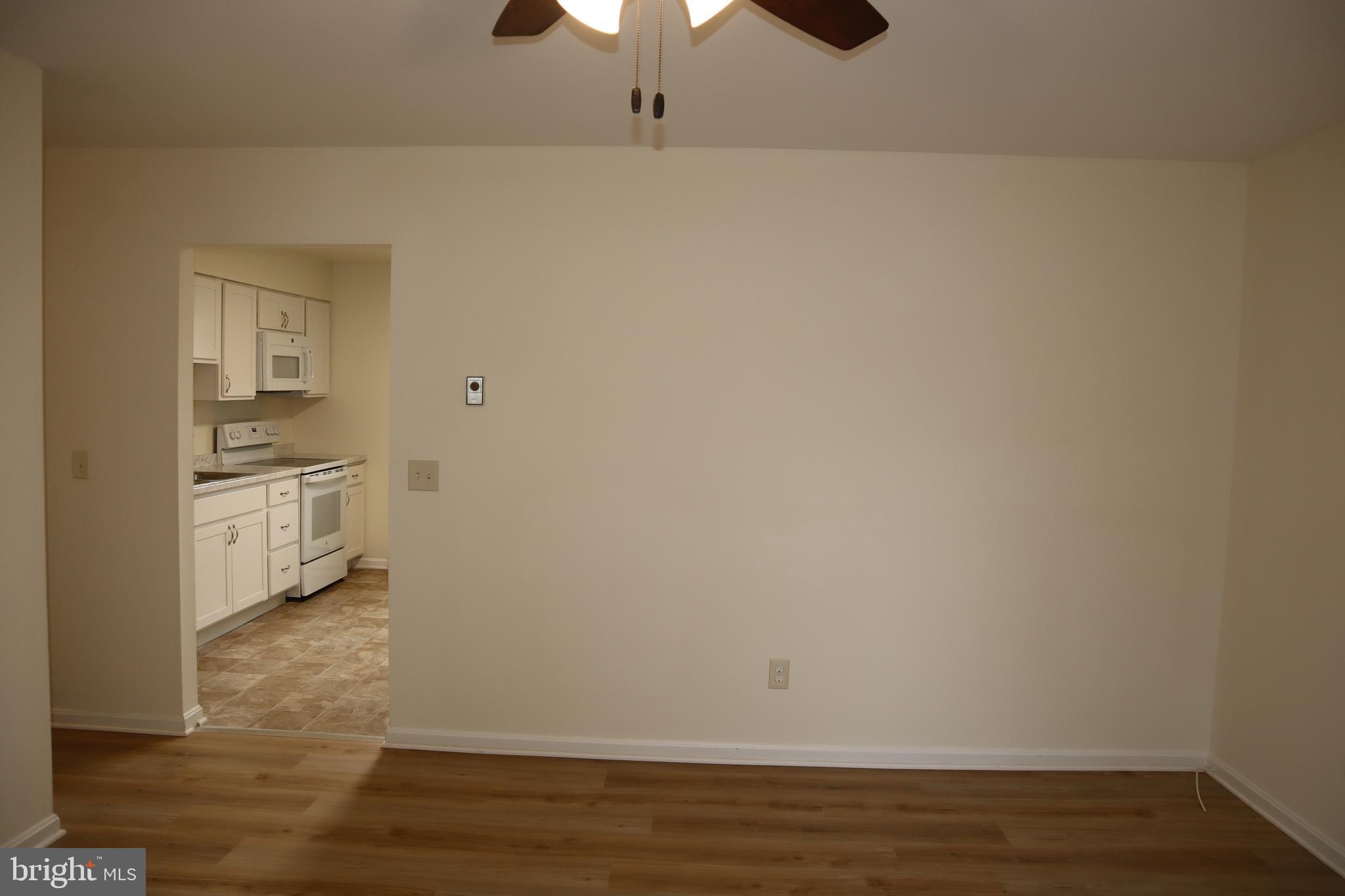 2 West Pine Street Delmar, MD 21875 - Photo 4 of 23 a view of empty room with wooden floor