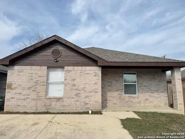 a front view of a house with garage