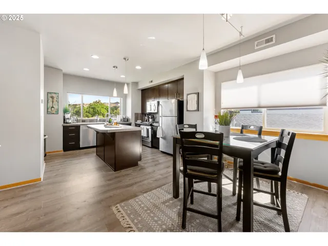 a kitchen with a table and chairs