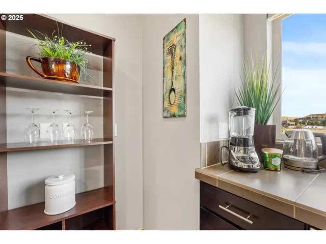 a stove top oven sitting inside of a kitchen